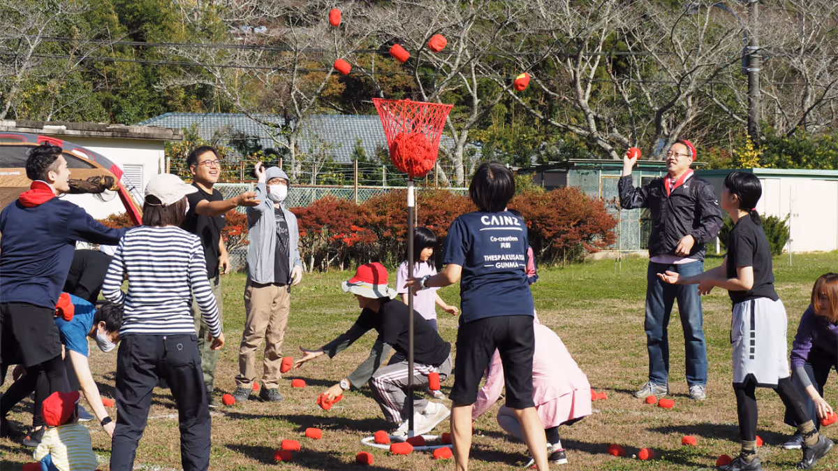 Smiling and interacting with each other by playing ball games.