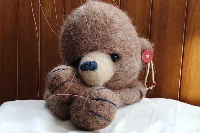 Close-up photo of a stuffed animal with brown fur.